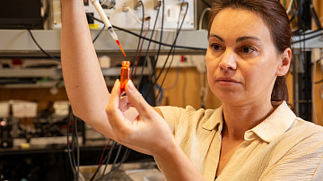 Controlling light with light using dyed liquid crystals